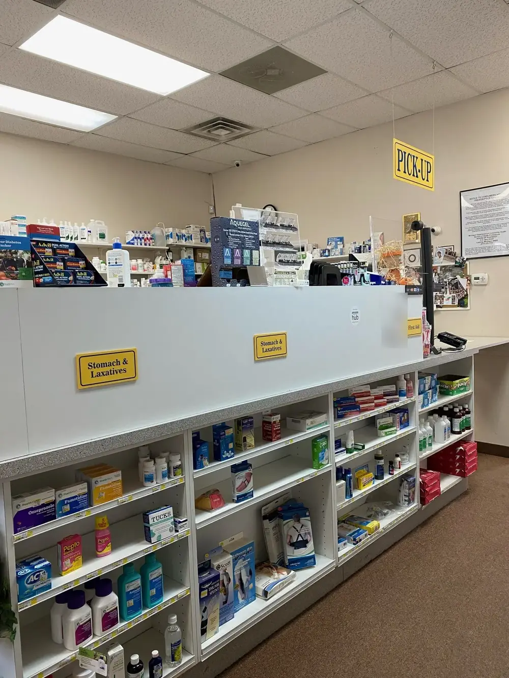 The Pick-Up counter, with stomach care, first aid and support braces on the shelves below.